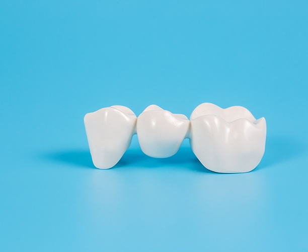 Dental bridge on a pale blue background