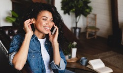 Woman smiling while talking on phone