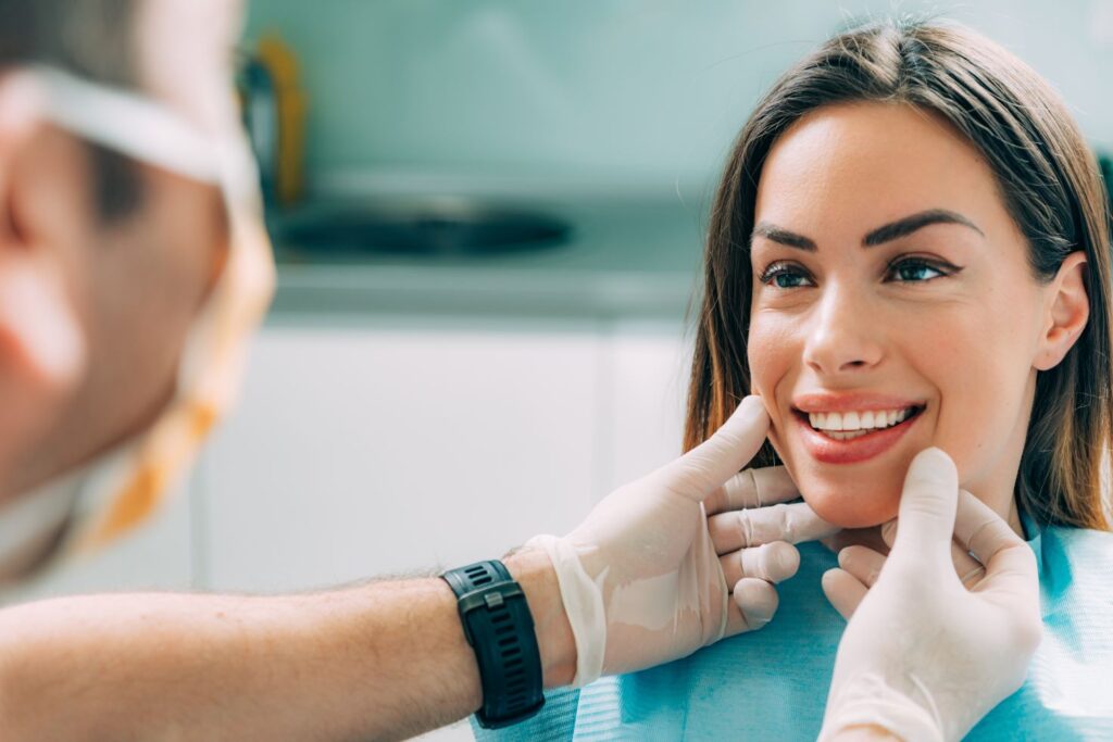 A woman having her teeth examined by a dentist.