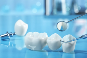 Close up of a dental bridge on blue table